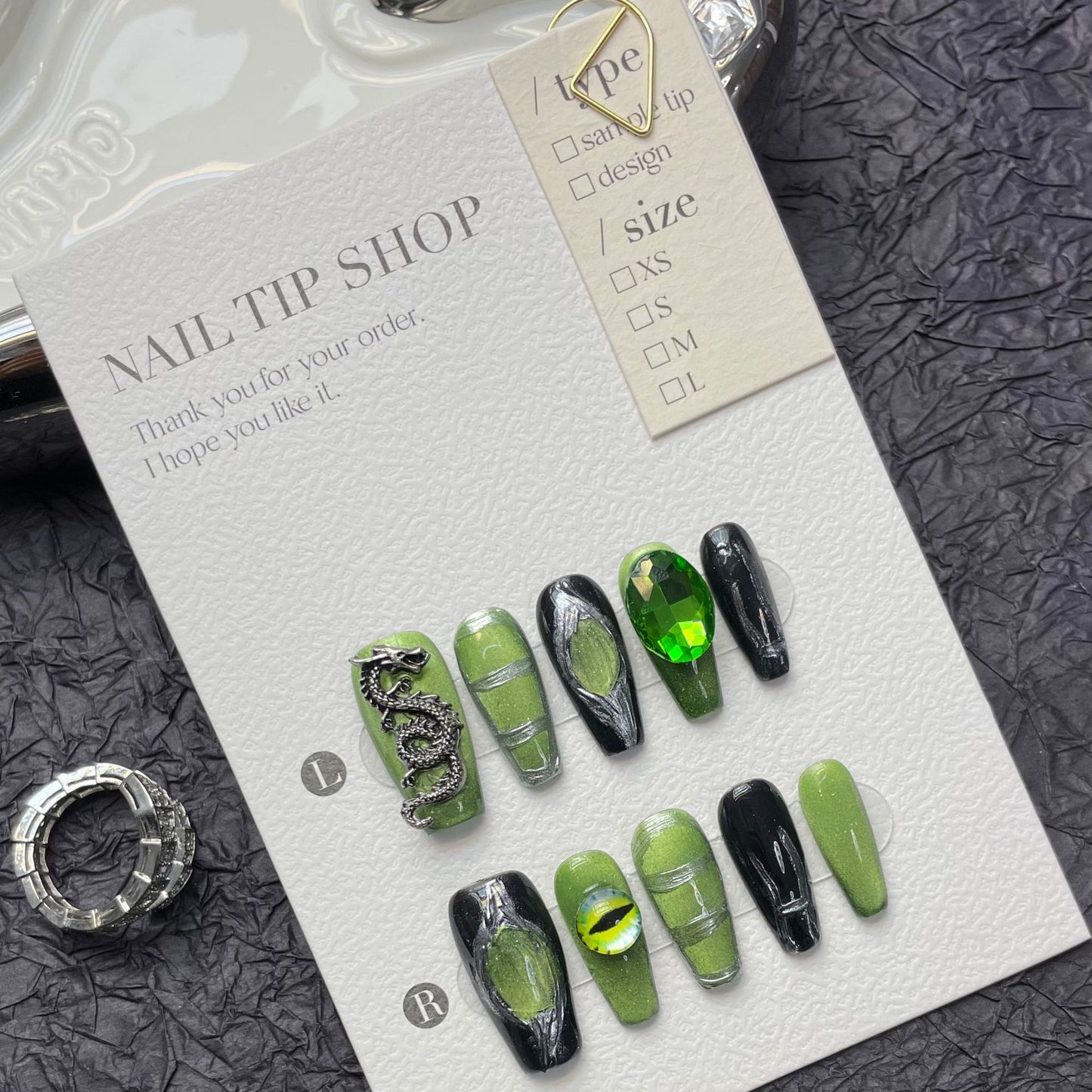 (reusable nail)Black nail art, metal, high setting, wearing armor, autumn and winter high-end products, medium length, cool style, heavy industry, cyberpunk