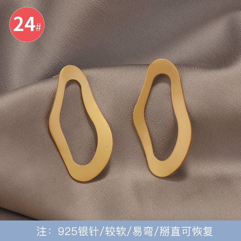 925银针新款猫眼石蝴蝶结耳环女韩国网红个性耳钉长款显脸瘦耳饰