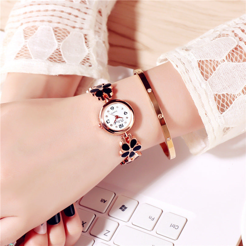 Fashion women's watchPollock Little Daisy Fashion Watch New Plum Blossom Women's Student Women's European and American Brand Electronic Watch