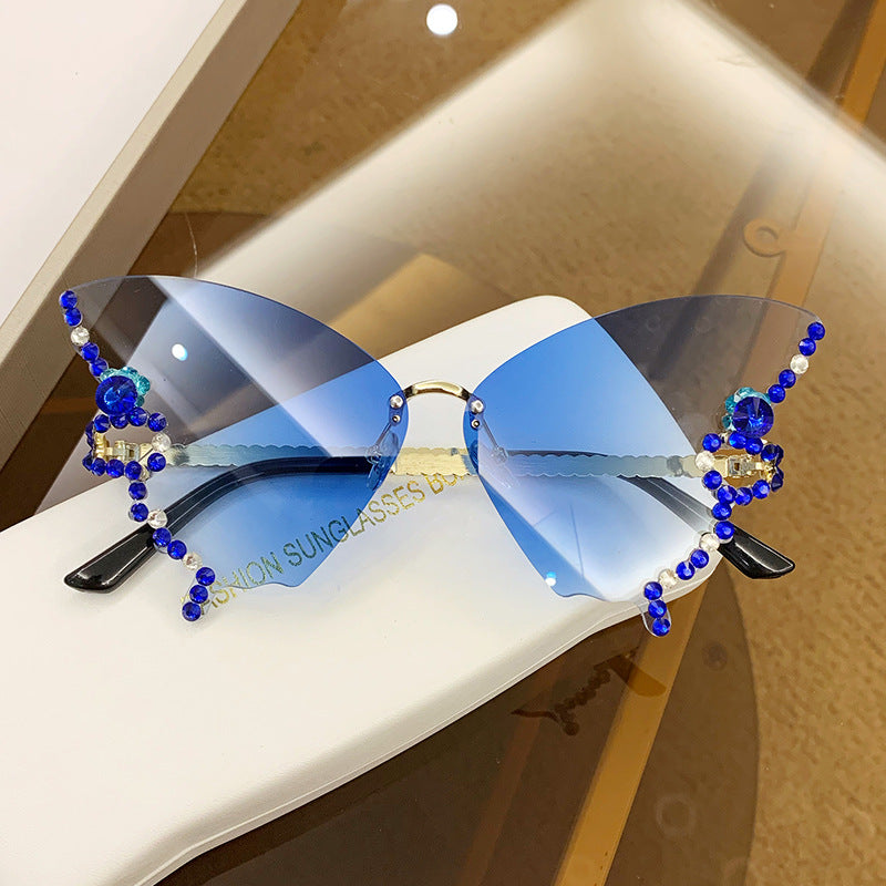 Women's fashion glasses 跨境2023新款蝴蝶形状镶钻无框太阳镜女欧美时尚个性夸张墨镜舞会