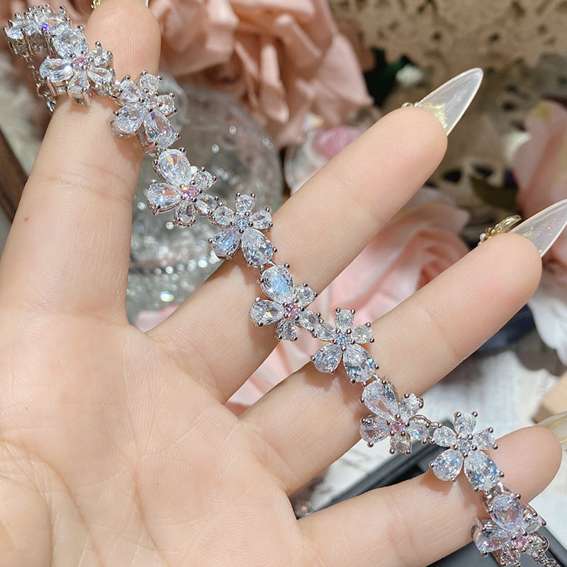 珠宝首饰山茶怦然心动系列胭脂粉宝石手链女 镀18K多切面超闪桃心满钻手链
