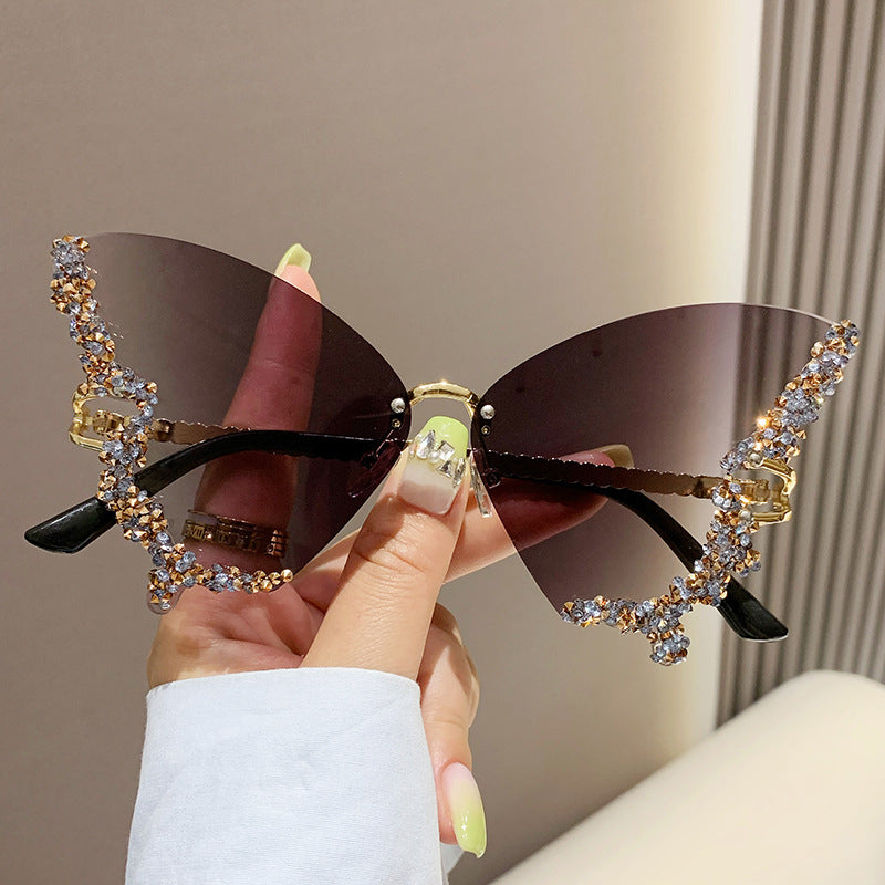 Women's fashion glasses 跨境2023新款蝴蝶形状镶钻无框太阳镜女时尚个性夸张墨镜欧美网红