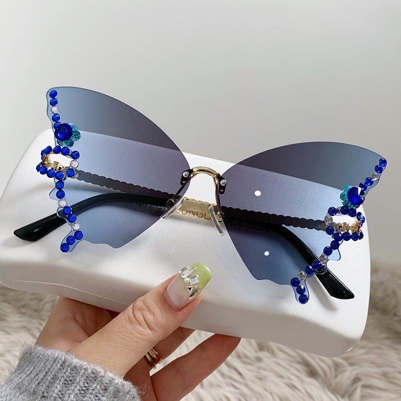 Women's fashion glasses 跨境热销个性无框切边蝴蝶形状镶钻太阳镜高级感时尚走秀搞怪墨镜