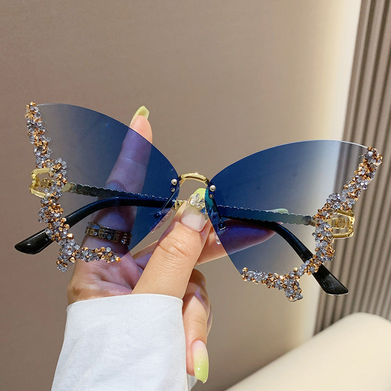 Women's fashion glasses 跨境2023新款蝴蝶形状镶钻无框太阳镜女时尚个性夸张墨镜欧美网红