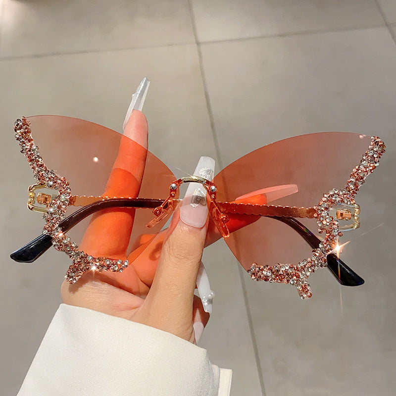 Women's fashion glasses 欧美跨境新款蝴蝶镶碎钻无边框太阳镜复古时尚个性穿搭高级感墨镜
