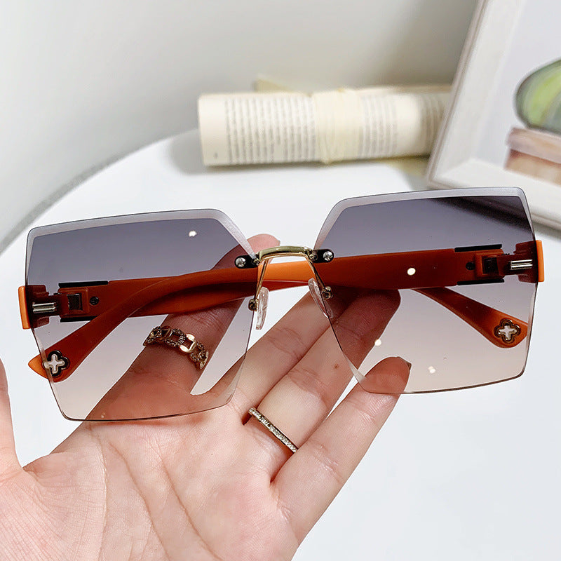 Women's fashion glasses 2022欧美潮流跨境无框切边连体式太阳镜男女个性街拍走秀时尚墨镜