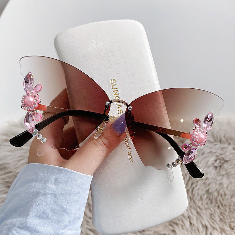 Women's fashion glasses 欧美跨境新款舞会蝴蝶形状镶钻无框太阳镜女夸张墨镜女圆脸大脸