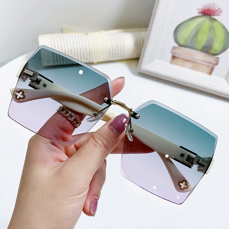 Women's fashion glasses 2022欧美潮流跨境无框切边连体式太阳镜男女个性街拍走秀时尚墨镜