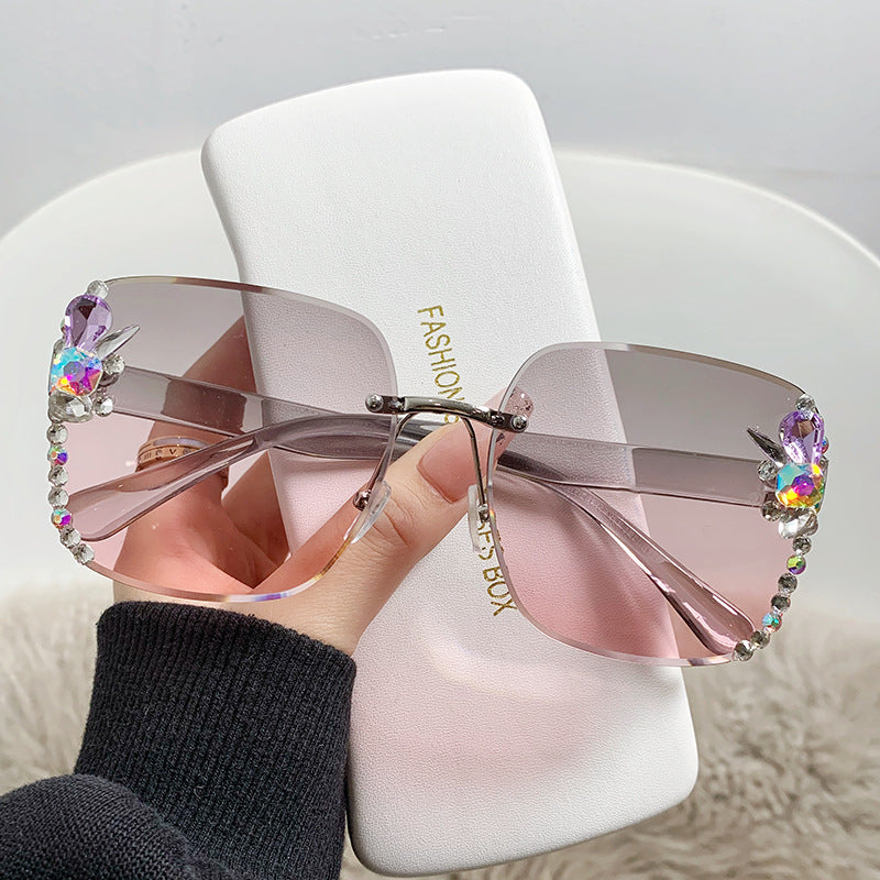 Women's fashion glasses 2023跨境欧美无框切边女士镶钻太阳镜时尚大框遮阳防紫外线墨镜批