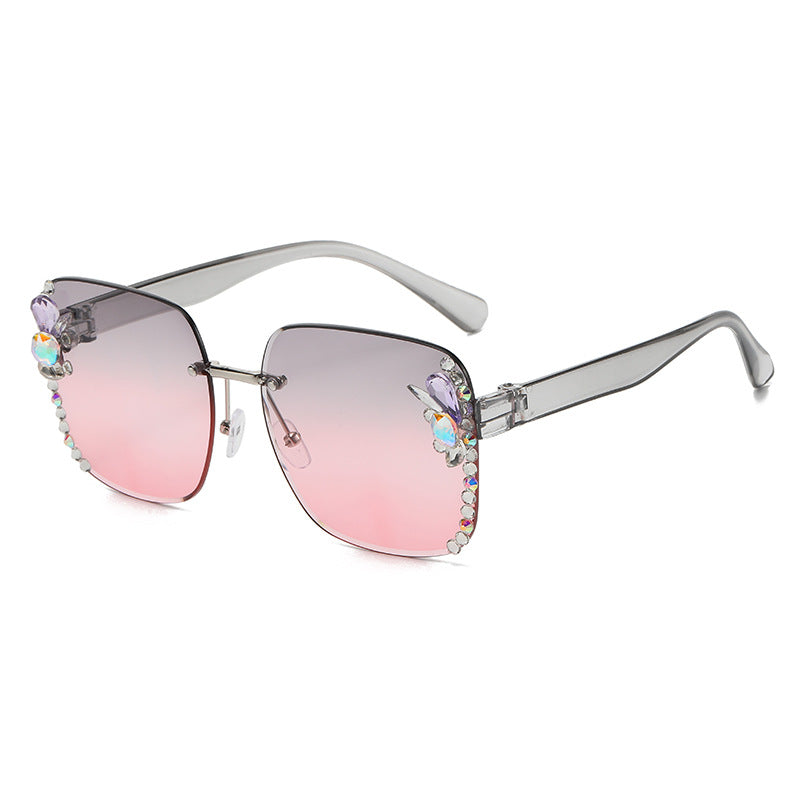 Women's fashion glasses 2023跨境欧美无框切边女士镶钻太阳镜时尚大框遮阳防紫外线墨镜批