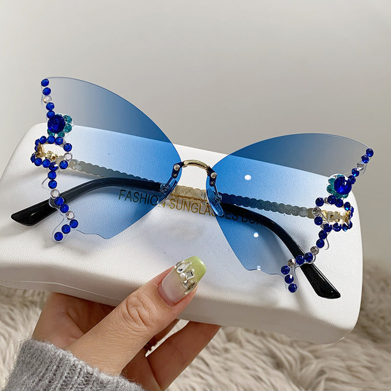 Women's fashion glasses 跨境热销个性无框切边蝴蝶形状镶钻太阳镜高级感时尚走秀搞怪墨镜