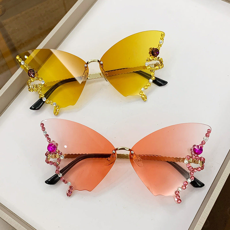 Women's fashion glasses 跨境2023新款蝴蝶形状镶钻无框太阳镜女欧美时尚个性夸张墨镜舞会