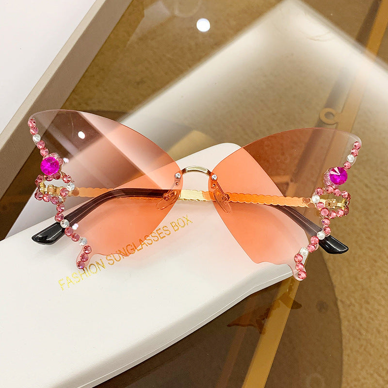 Women's fashion glasses 跨境2023新款蝴蝶形状镶钻无框太阳镜女欧美时尚个性夸张墨镜舞会