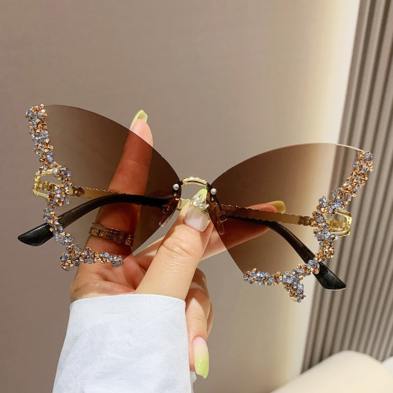 Women's fashion glasses 跨境2023新款蝴蝶形状镶钻无框太阳镜女时尚个性夸张墨镜欧美网红