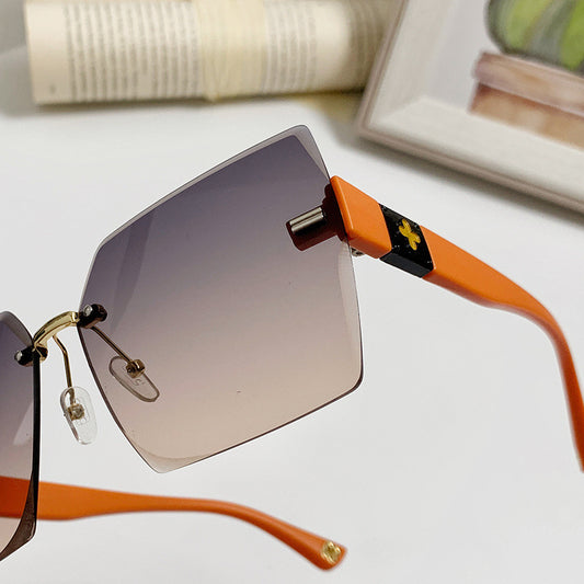 Women's fashion glasses 2022欧美潮流跨境无框切边连体式太阳镜男女个性街拍走秀时尚墨镜