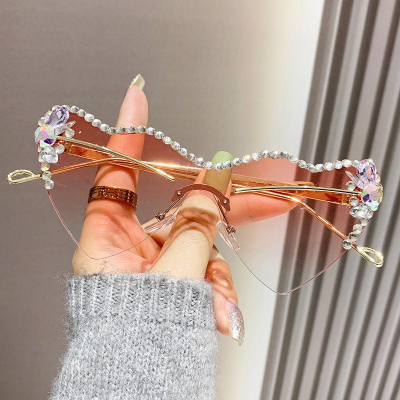 Women's fashion glasses 跨境新款爱心连体镜片无框镶钻猫眼太阳镜时尚女士墨镜桃心渐变色