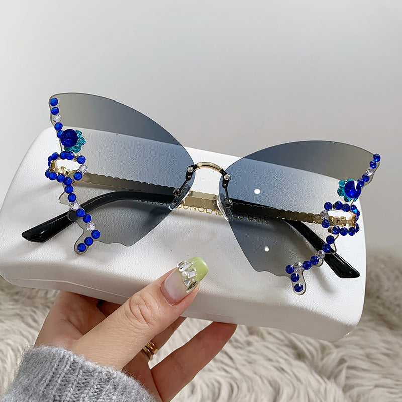 Women's fashion glasses 跨境热销个性无框切边蝴蝶形状镶钻太阳镜高级感时尚走秀搞怪墨镜