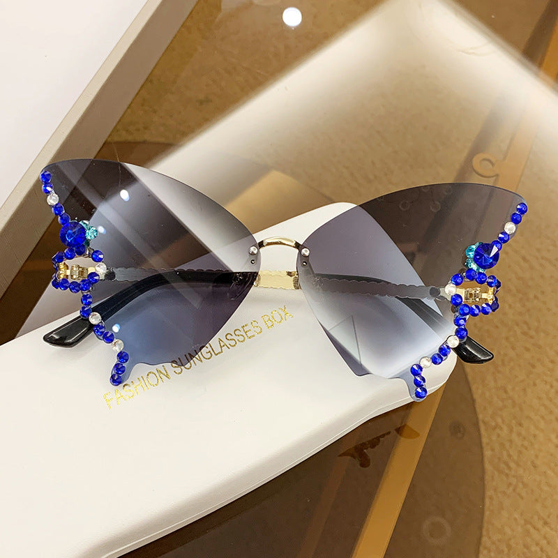 Women's fashion glasses 跨境2023新款蝴蝶形状镶钻无框太阳镜女欧美时尚个性夸张墨镜舞会