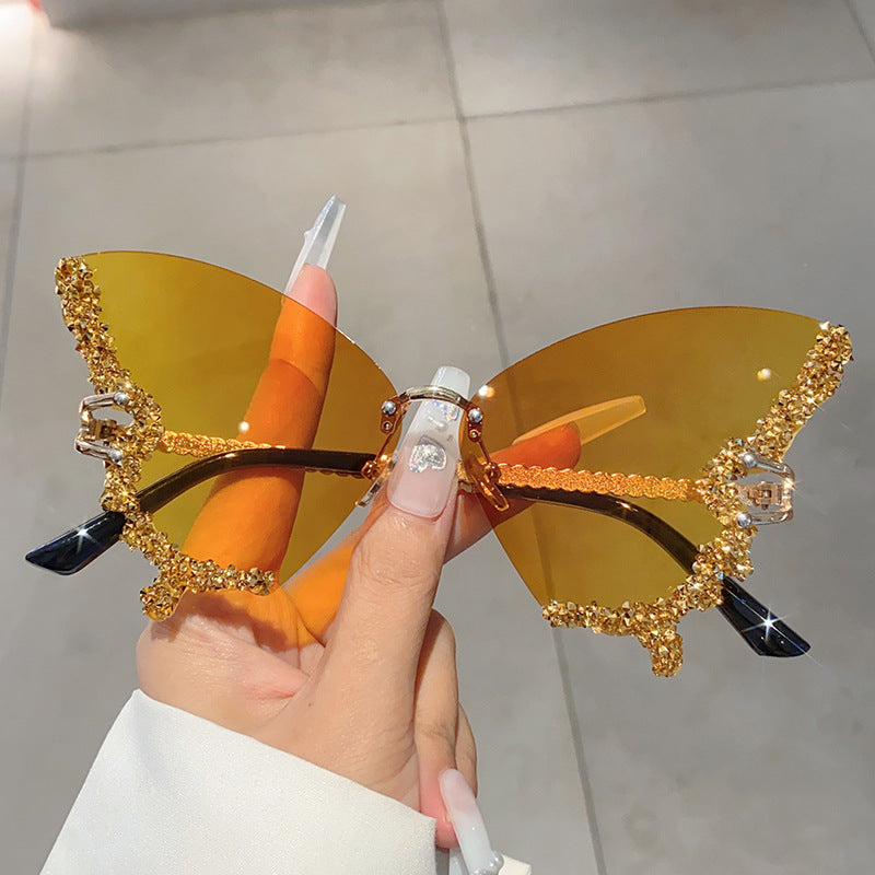 Women's fashion glasses 欧美跨境新款蝴蝶镶碎钻无边框太阳镜复古时尚个性穿搭高级感墨镜