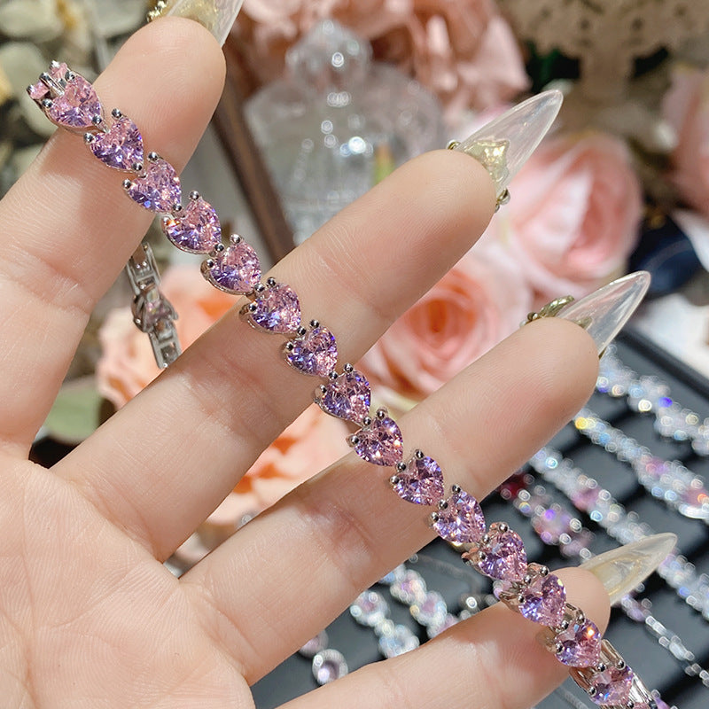 珠宝首饰山茶怦然心动系列胭脂粉宝石手链女 镀18K多切面超闪桃心满钻手链