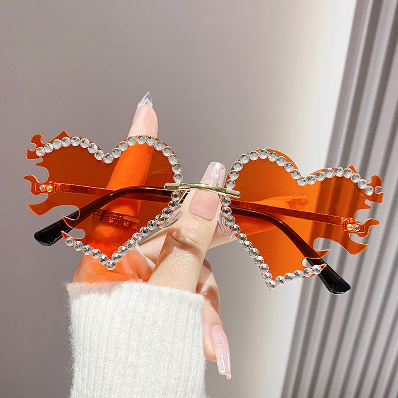 Women's fashion glasses 欧美墨镜太阳镜爱心个性街拍墨镜女无框时尚太阳眼镜批发