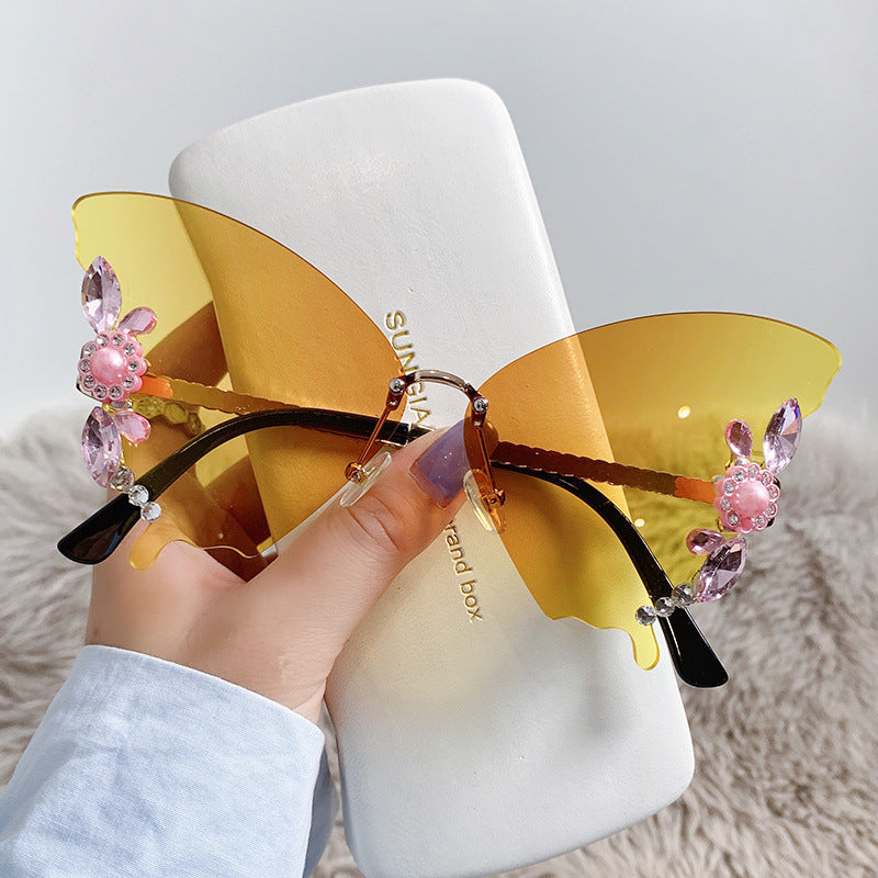 Women's fashion glasses 欧美跨境新款舞会蝴蝶形状镶钻无框太阳镜女夸张墨镜女圆脸大脸