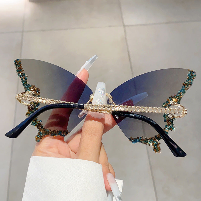 Women's fashion glasses 欧美跨境新款蝴蝶镶碎钻无边框太阳镜复古时尚个性穿搭高级感墨镜