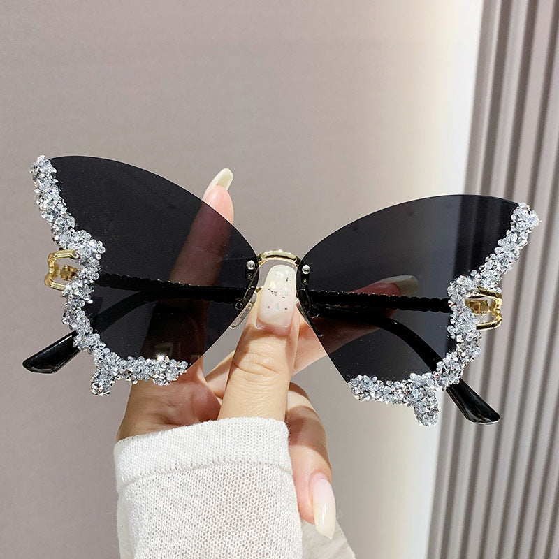 Women's fashion glasses 跨境2024新款蝴蝶形状镶钻无框太阳镜女时尚个性夸张墨镜欧美网红
