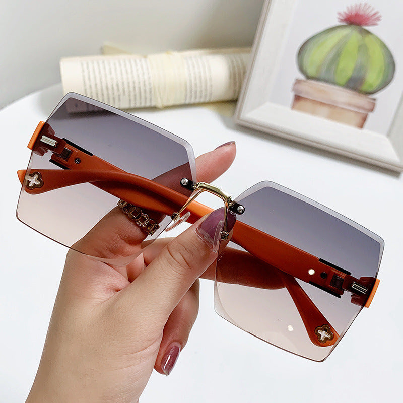 Women's fashion glasses 跨境新款四叶草女士太阳镜潮流抖音无框切边墨镜时尚开车旅游眼镜