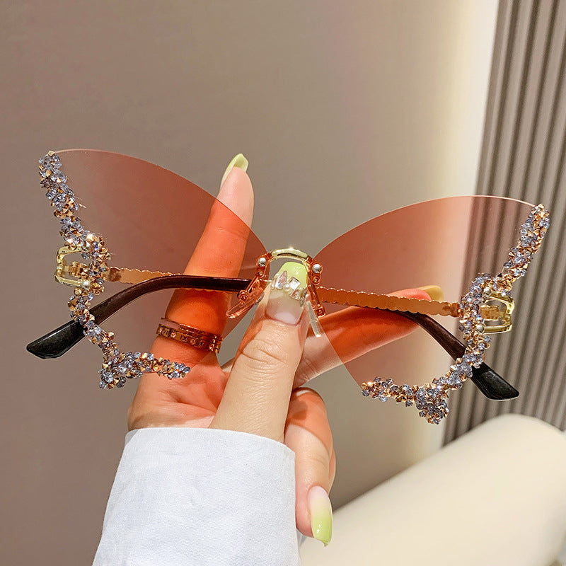 Women's fashion glasses 跨境2023新款蝴蝶形状镶钻无框太阳镜女时尚个性夸张墨镜欧美网红