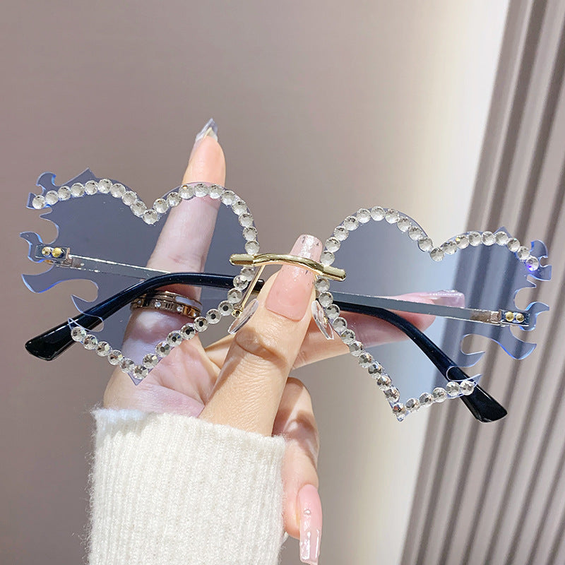 Women's fashion glasses 欧美墨镜太阳镜爱心个性街拍墨镜女无框时尚太阳眼镜批发
