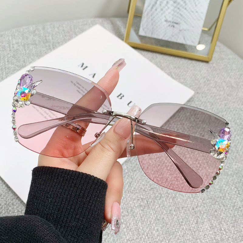 Women's fashion glasses 2023跨境欧美无框切边镶钻太阳镜女防紫外线墨镜海洋片遮阳眼镜