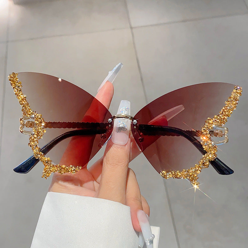 Women's fashion glasses 欧美跨境新款蝴蝶镶碎钻无边框太阳镜复古时尚个性穿搭高级感墨镜