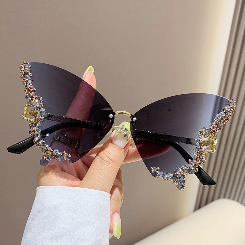 Women's fashion glasses 跨境2023新款蝴蝶形状镶钻无框太阳镜女时尚个性夸张墨镜欧美网红