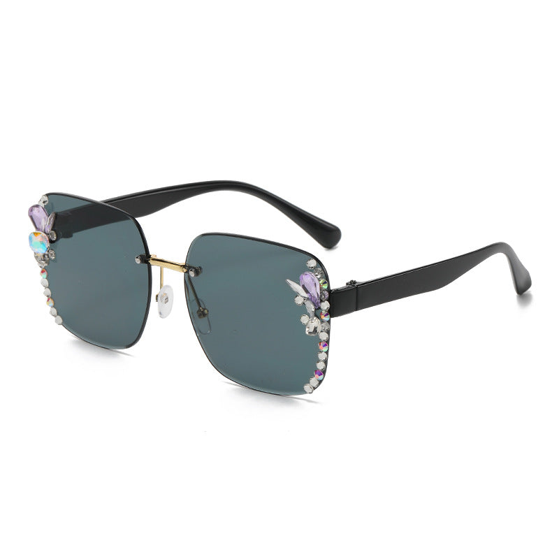 Women's fashion glasses 2023跨境欧美无框切边女士镶钻太阳镜时尚大框遮阳防紫外线墨镜批