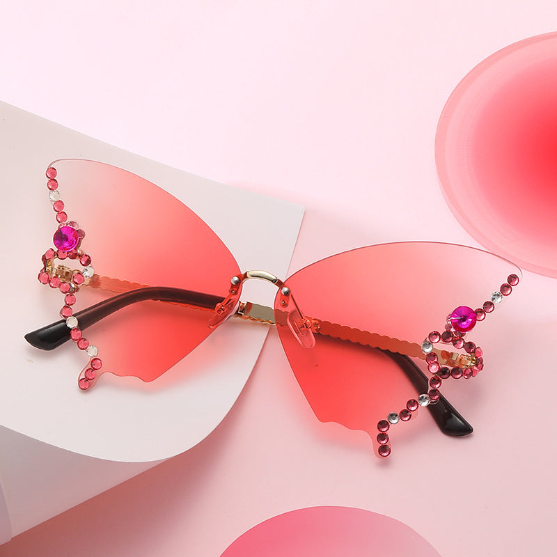 Women's fashion glasses 跨境2023新款蝴蝶形状镶钻无框太阳镜女时尚个性夸张墨镜欧美网红