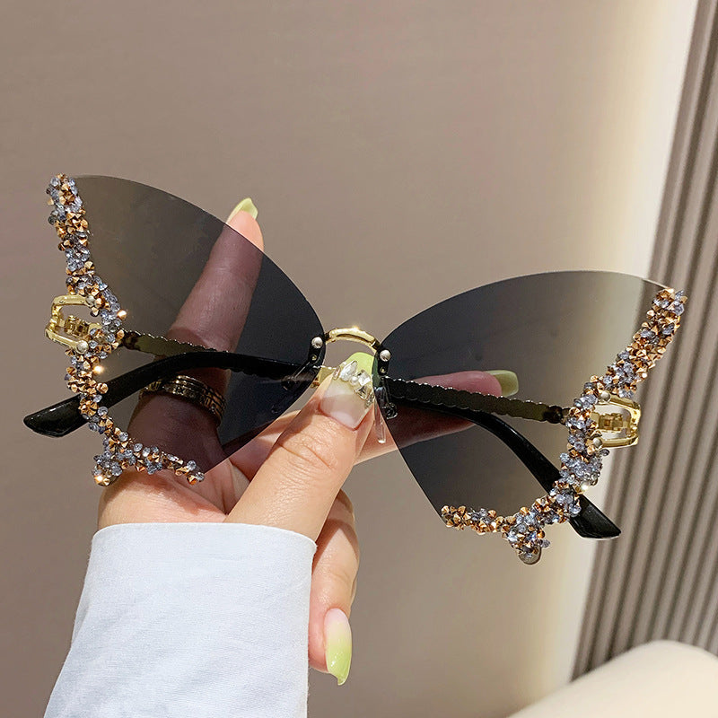 Women's fashion glasses 跨境2023新款蝴蝶形状镶钻无框太阳镜女时尚个性夸张墨镜欧美网红