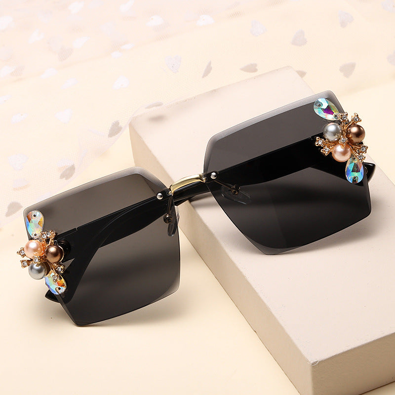 Women's fashion glasses 2023跨境无框切边镶珍珠太阳镜女防紫外线墨镜夏季防晒高级感显瘦