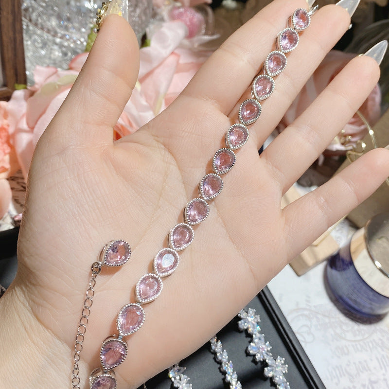 珠宝首饰山茶怦然心动系列胭脂粉宝石手链女 镀18K多切面超闪桃心满钻手链