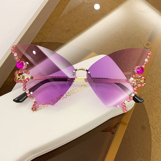 Women's fashion glasses 跨境2023新款蝴蝶形状镶钻无框太阳镜女欧美时尚个性夸张墨镜舞会