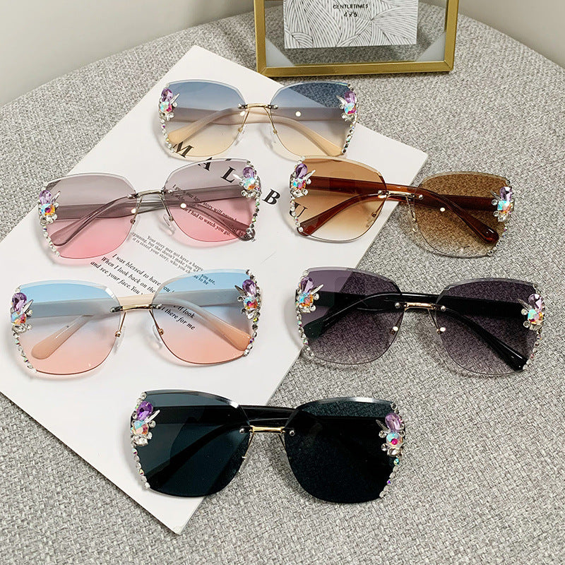Women's fashion glasses 2023跨境欧美无框切边镶钻太阳镜女防紫外线墨镜海洋片遮阳眼镜