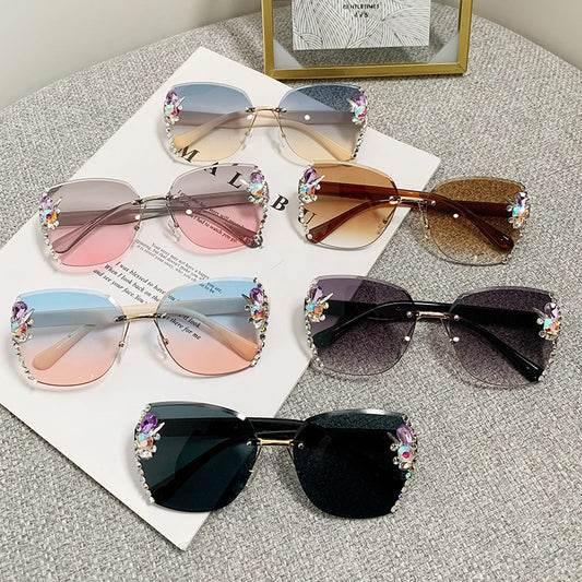 Women's fashion glasses 2023跨境欧美无框切边镶钻太阳镜女防紫外线墨镜海洋片遮阳眼镜