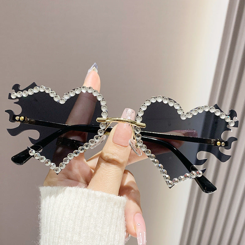 Women's fashion glasses 欧美墨镜太阳镜爱心个性街拍墨镜女无框时尚太阳眼镜批发