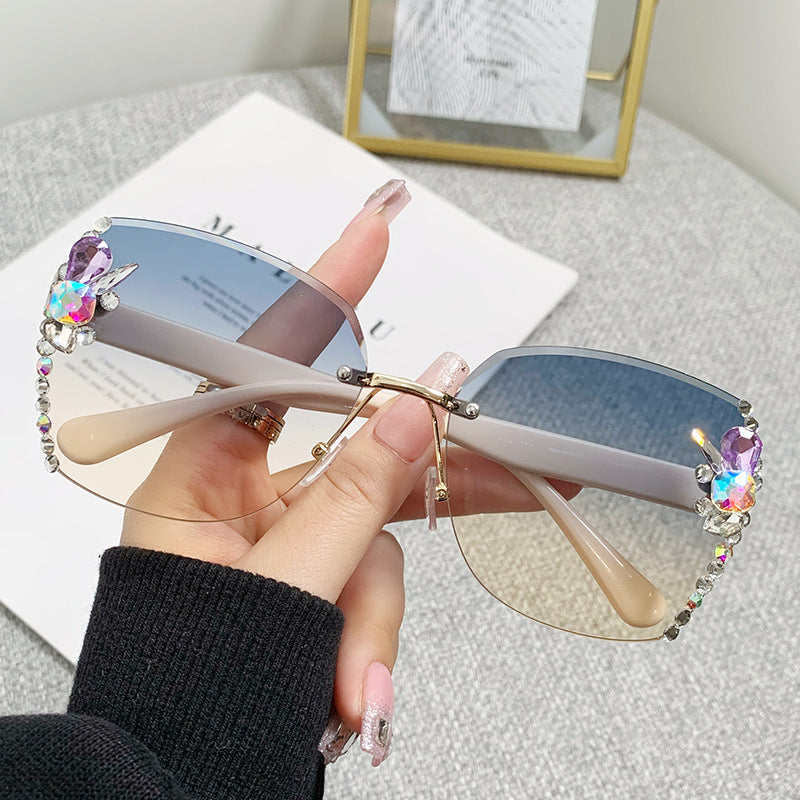 Women's fashion glasses 2023跨境欧美无框切边镶钻太阳镜女防紫外线墨镜海洋片遮阳眼镜